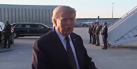 In the image donald trump is shown in the airport