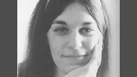 In the image Ronni Moffitt is shown smiling