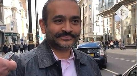 In the image Nirav Modi is shown standing in the UK road