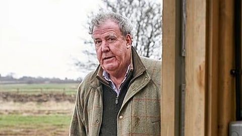 In the image Jeremy Clarkson is shown standing in a green surrounding