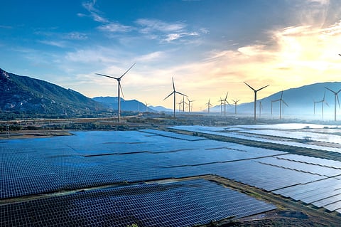 a picture of series of windmill and solar panels.