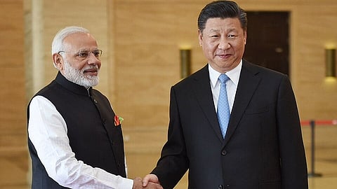 Narendra Modi shaking hands with Xi Jinping