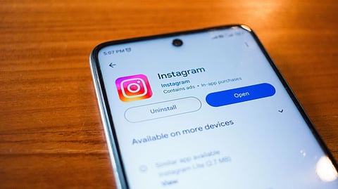 Instagram logo displayed on a smartphone amid allegations of child sexual abuse advertisements