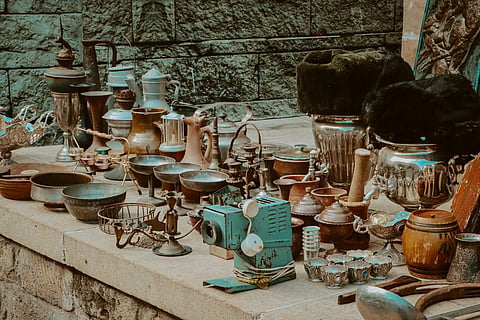 Image shows different types of old container.