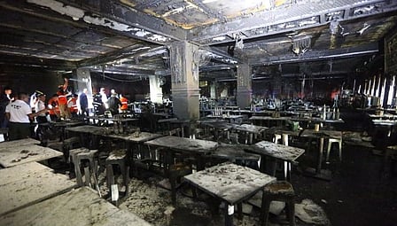 Image of Thailand fire in which 27 people were killed. The image shows a room completely destroyed in the fire accident. Authorities are inspecting the spot.