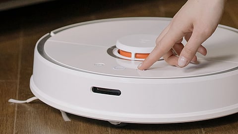 In the image a vacuum cleaning robot is shown