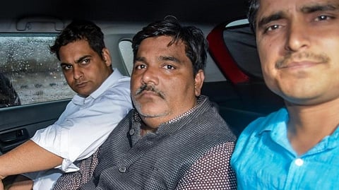 Tahir Hussain sitting in the car with accomplices