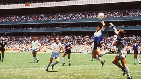 Diego Maradona scoring the iconic Hand of God