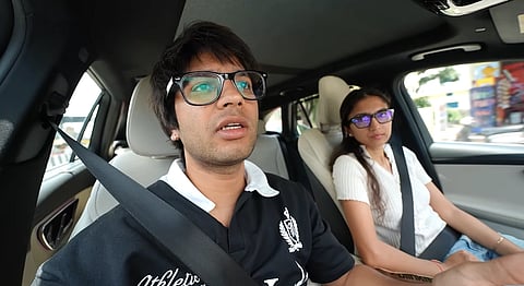 In the image Saurav Joshi is shown in a Mercedes-Benz SUV with a girl 