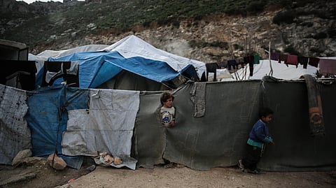 Climate-displaced families relocate after flooding and environmental degradation, highlighting the growing global climate refugee crisis.
