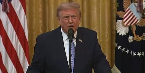 In the image President of USA Donald Trump is shown adressing the public from White House