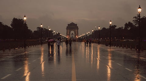 In the image the Monsoon season of Delhi is shown with the view of India Gate