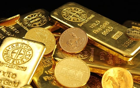 In the image gold busicuits and coins are shown
