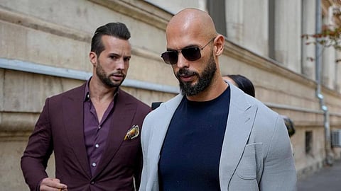In the image Andrew Tate and Tristan Tate is shown wearing formal outfits
