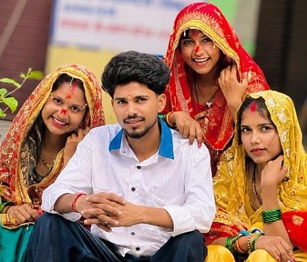 Image of Vikas and his three wives Santosh, Saroj and Savitri in a bridal attire. 