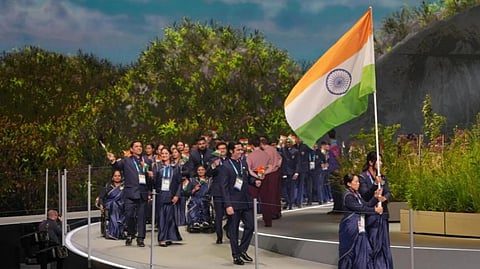 India flag and people walking with it