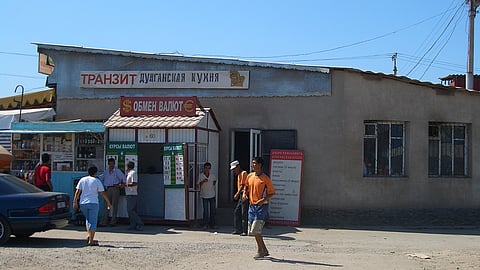 A building exterior featuring a prominent sign displaying its name and purpose.