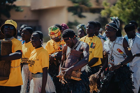 Members of an Indigenous community celebrating their cultural heritage while highlighting Indigenous rights, land stewardship, and traditional knowledge