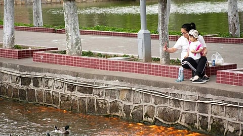 chinese woman with kid