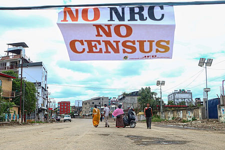 A No NRC No Census paper in a wire and a view of Manipur