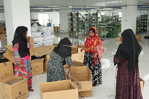 Garment factory workers on a production floor in Bangladesh