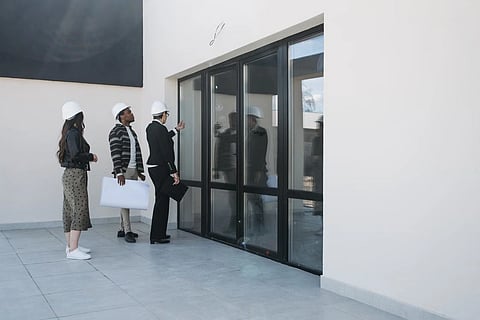 Door-to-door sales representative at a front door