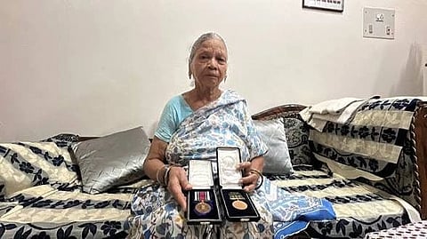 In the image Vivek Saxena's mother Savitri Saxena is shown 