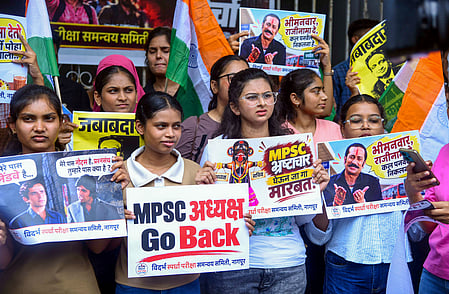 In the image many female student protesters are shown holding pamphlets
