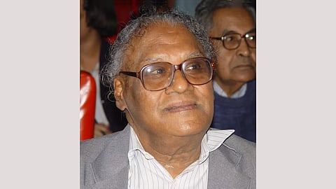 A man wearing a spectacles looking at the camera.