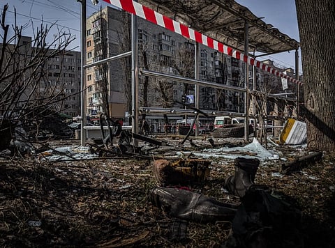 A demolished bus stop in Kyiv, Ukraine, showcasing signs of conflict and devastation.
