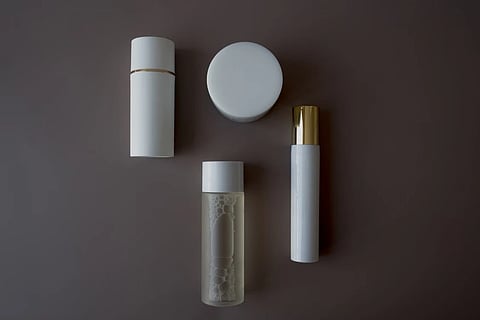 Cosmetic glass bottles with various closure types, droppers, and pumps