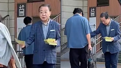 former ex japan PM Yoshihiko Noda flyers train station viral video