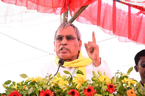 In the image SBSP Chief Om Prakash Rajbhar is shown addressing the public