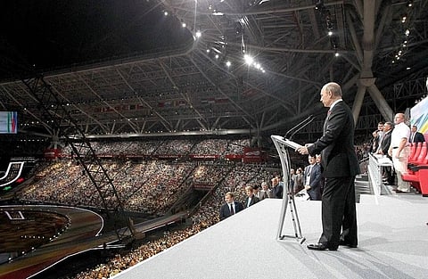 Image of Vladimir Putin addressing a crowd in 2013