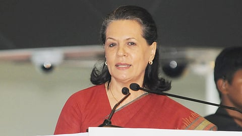 Sonia Gandhi in the podium addressing people