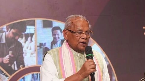 In the image MP Jiten Ram Manjhi is shown adressing the people
