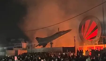 A student climbed atop a  decommissioned MiG-23UM aircraft during the protest at Lovely Professional University