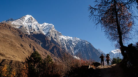 Trekkers approaching Larkya La Pass on the Manaslu Circuit trek