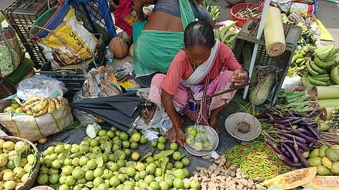 A woman selling vegetables in the market