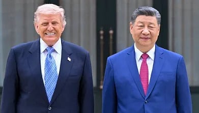 Image of trump and Xi Jinping in a blue suit and positing for pictures. 
