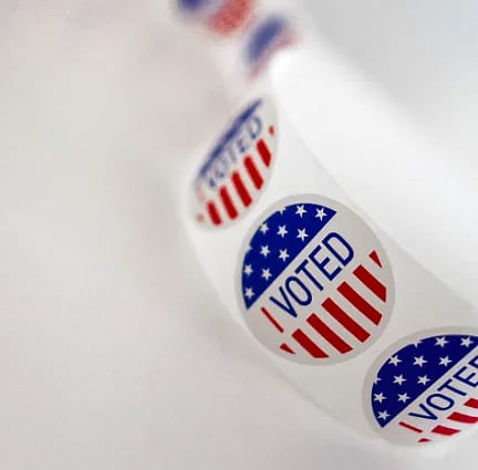 I Voted stickers in a roll, symbolizing civic engagement and democracy
