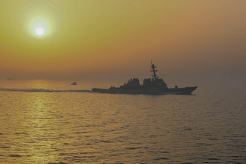 The guided-missile destroyer USS Stout (DDG 55) travels alongside the amphibious assault ship USS Bataan (LHD 5) during a transit through the Strait of Hormuz, May 31, 2020.
