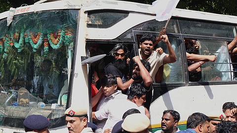 Jantar Mantar protesters are shown detained by Delhi police in the Bus