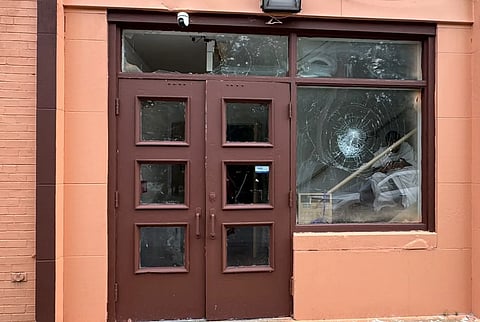 Image of the windows being broken after an act of vandalism at a Hindu temple in Ohio