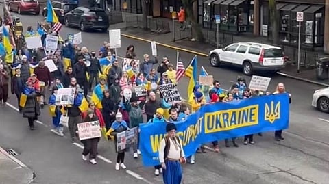 Ukrainians in the United States of America protesting on the streets in support of their country.