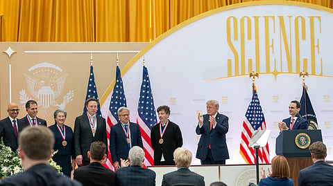 In the image tech leaders are shown being honoured by President Trump
