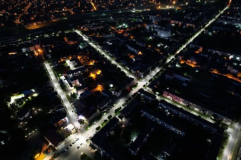 Drone capture of Kovel, Ukraine at night showcasing illuminated streets and buildings.
6