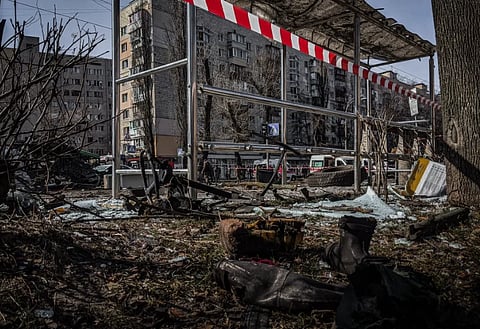 A demolished bus stop in Kyiv, Ukraine, showcasing signs of conflict and devastation.
