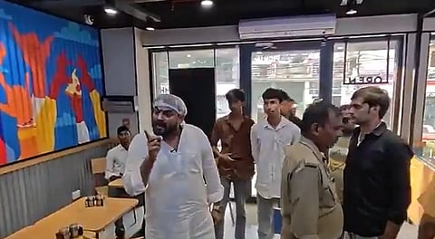 In the image many people are shown inside Dominos restaurant of fatehpur, UP