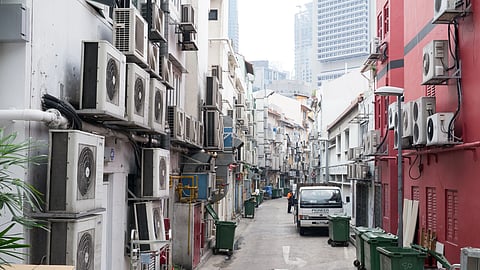 A lane in Singapore with numerous air conditioners